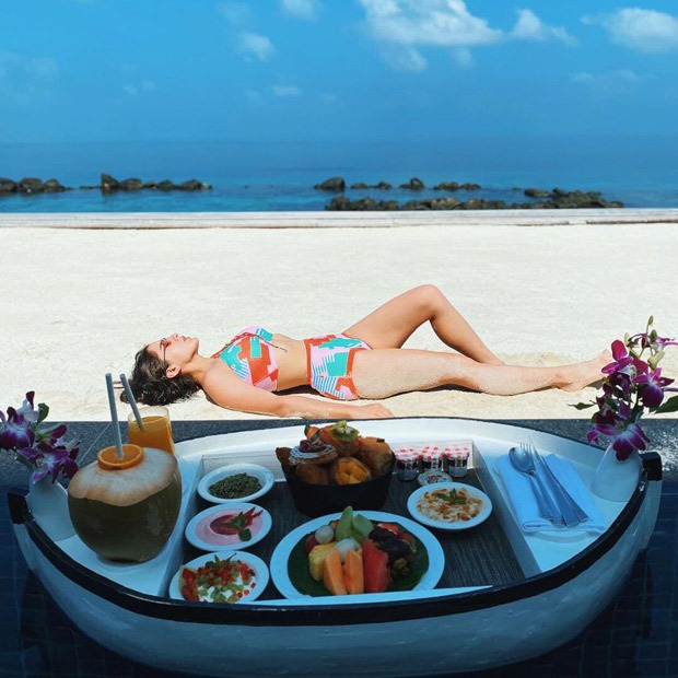 Sara Ali Khan soaks in the sun in a printed bikini during her Maldives vacation; shares a shayari along pictures